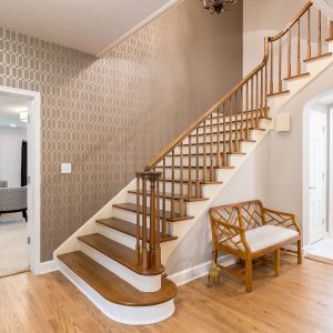 Wichitarealestate-7-wsu-square A wooden staircase with white railing and wood steps.